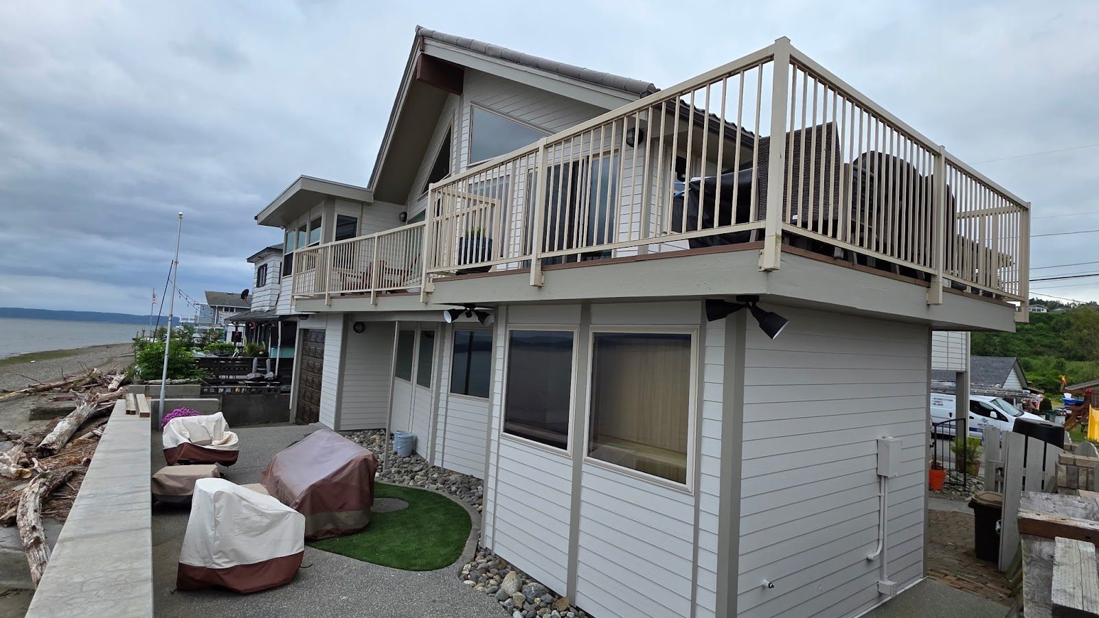 Waterfront home exterior freshly repainted by Lines Painting