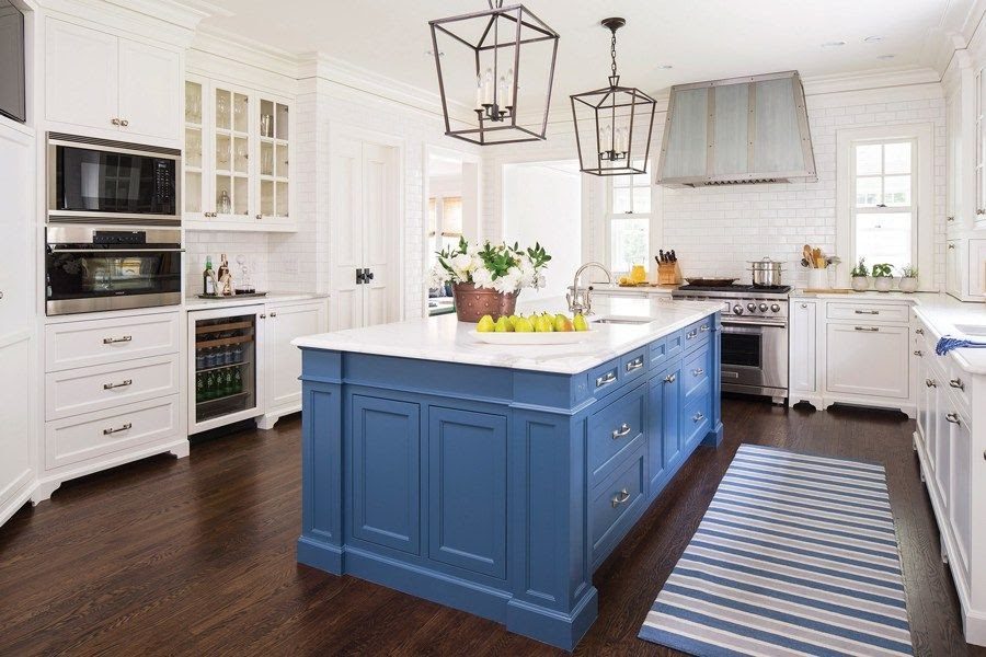 Bright white kitchen with a freshly painted blue island by Lines Painting